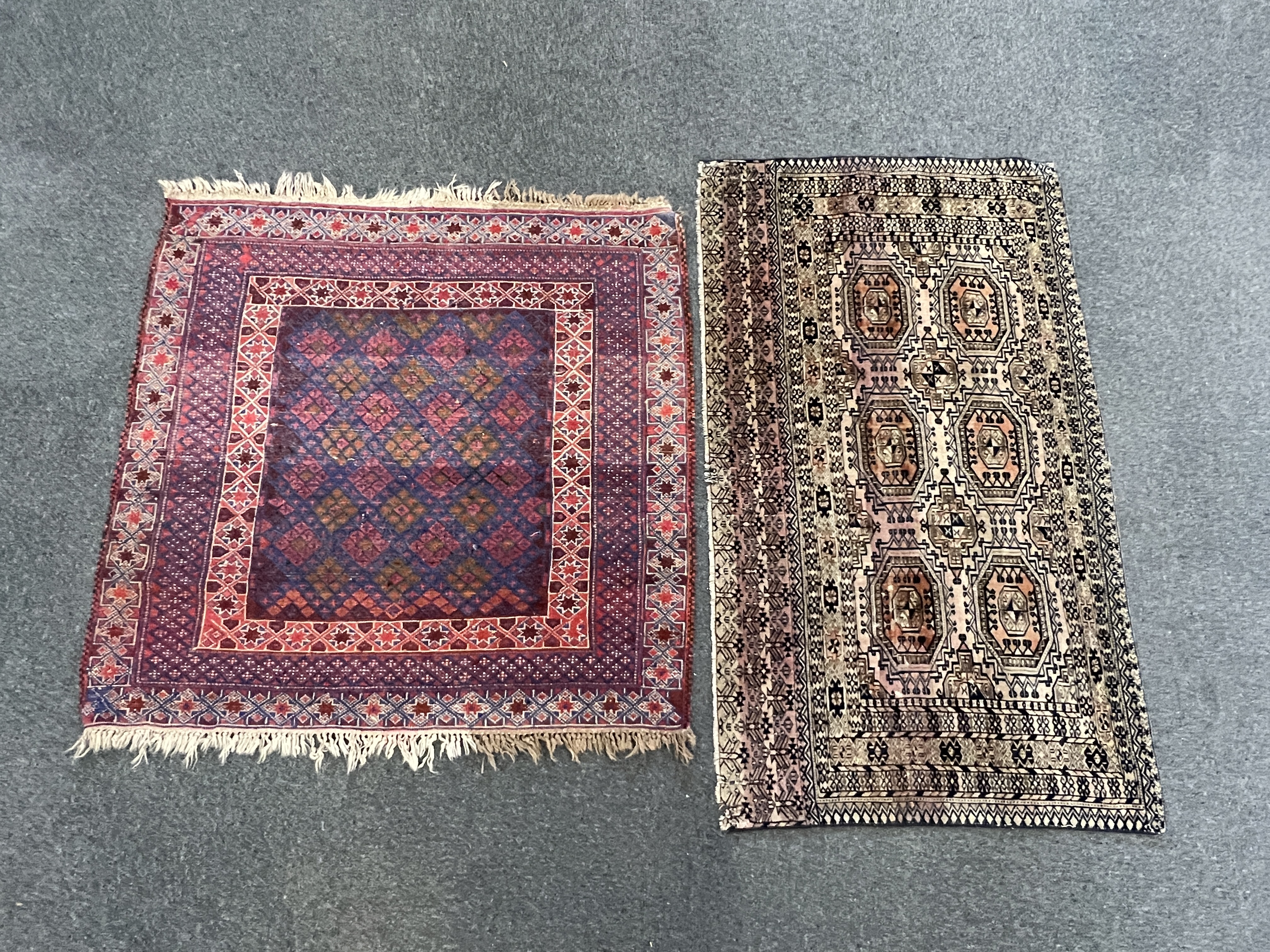 Two Afghan rugs / saddlebags, larger 104 x 108cm. Condition - fair